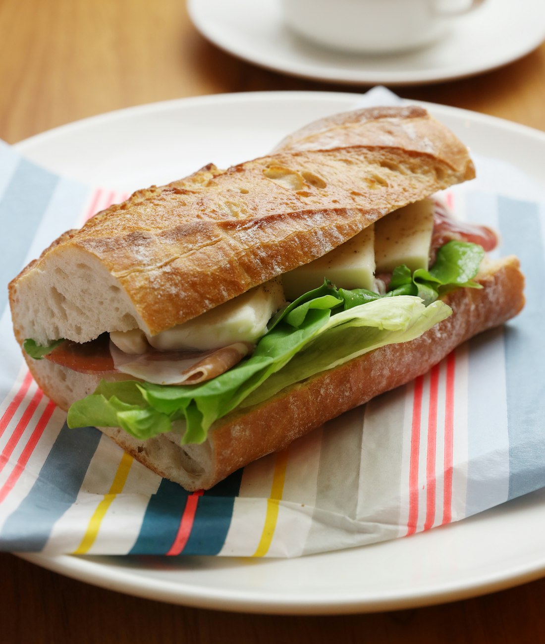 A filled baguette sandwich on a plate