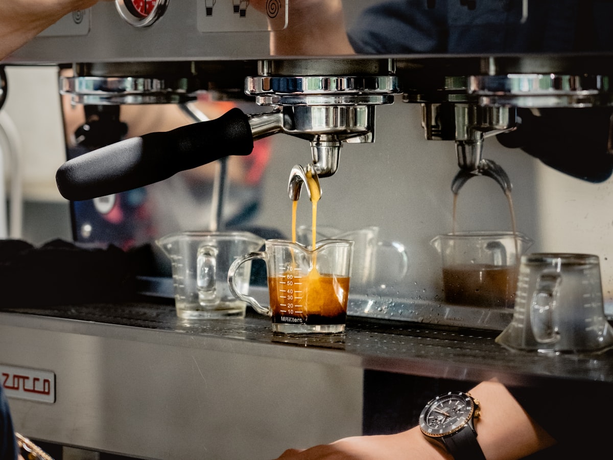 Espresso running from the machine into a glass